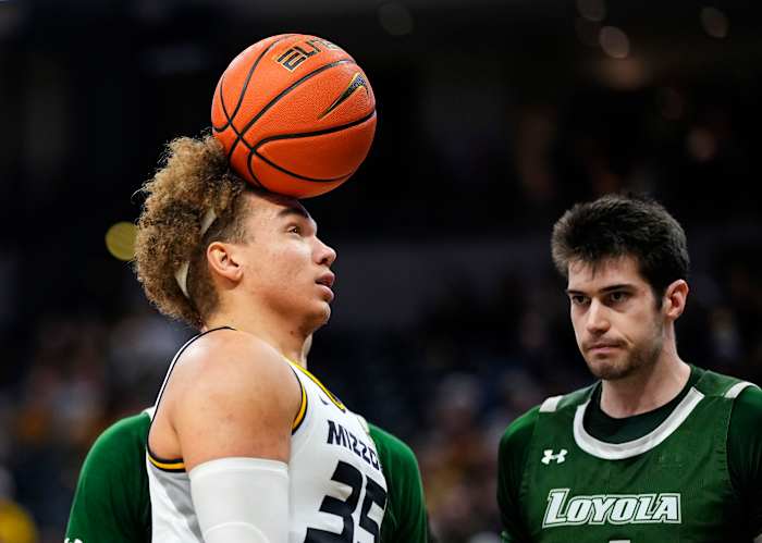 Missouri Tigers forward Noah Carter (35) heads the ball after scoring while fouled by Loyola (Md) Greyhounds forward Alonso Faure (4) during the second half at Mizzou Arena.